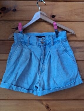 American Eagle Outfitters women's high-rise pleated cuffed denim mom shorts. 